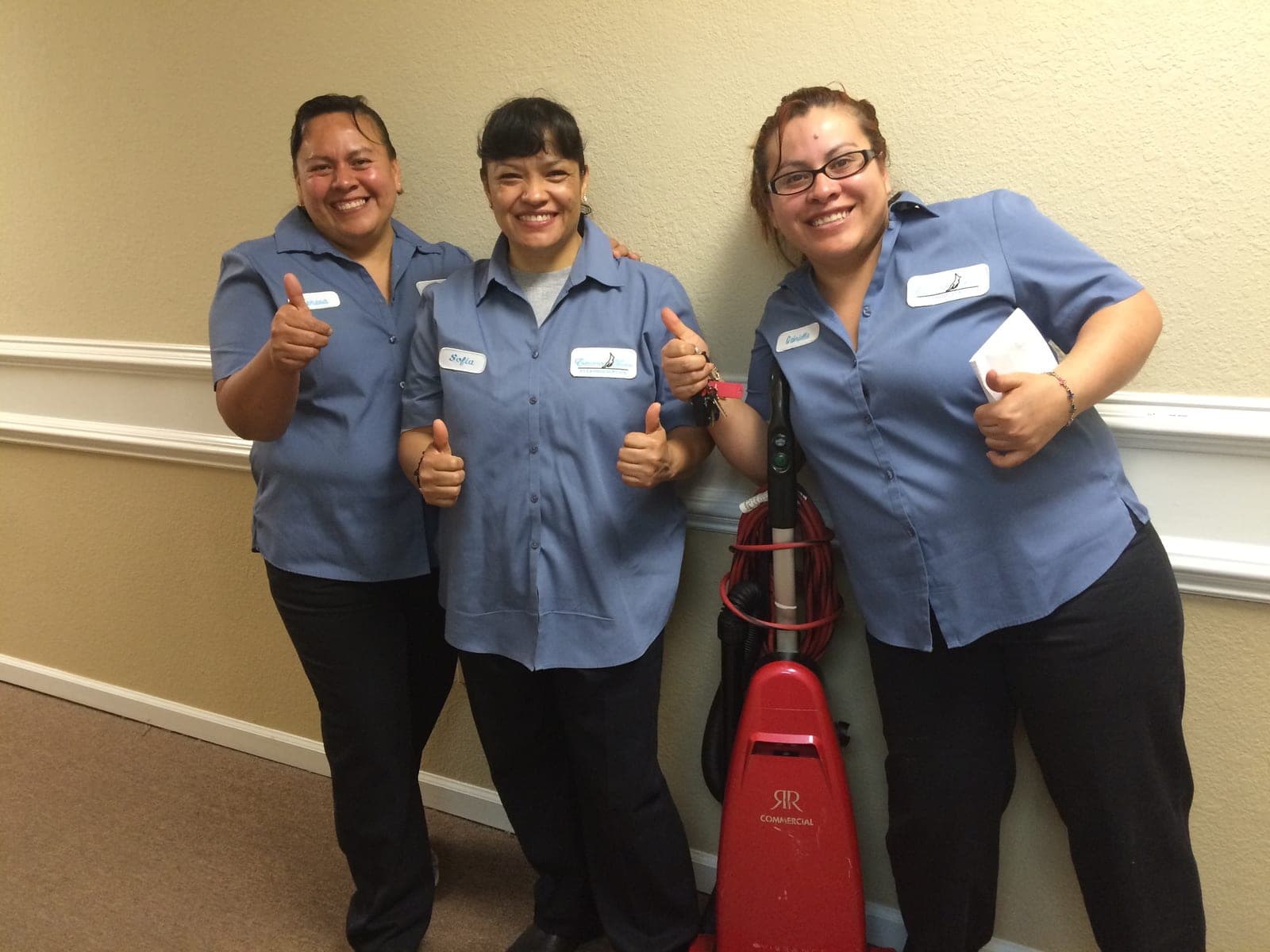 The Executive Touch team giving a thumbs up